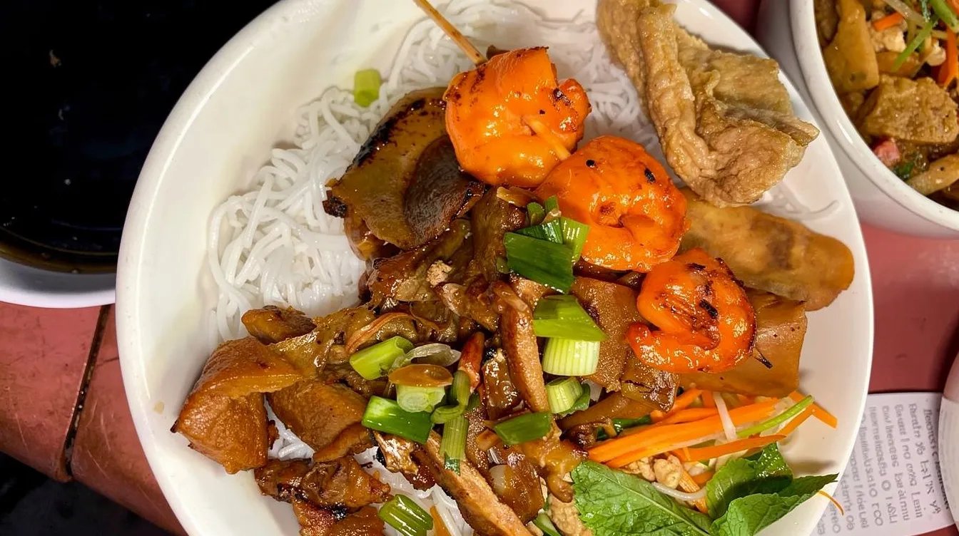 53. Charbroiled Pork, Beef or Chicken, Charbroiled Shrimp, Egg Rolls & Crispy Stuffed Bean Curd over Vermicelli