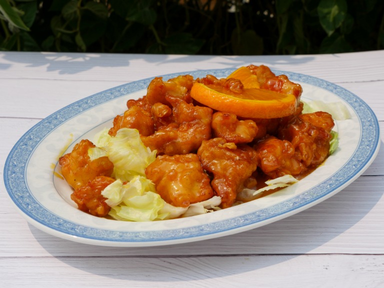 X33. Orange Chicken over Rice